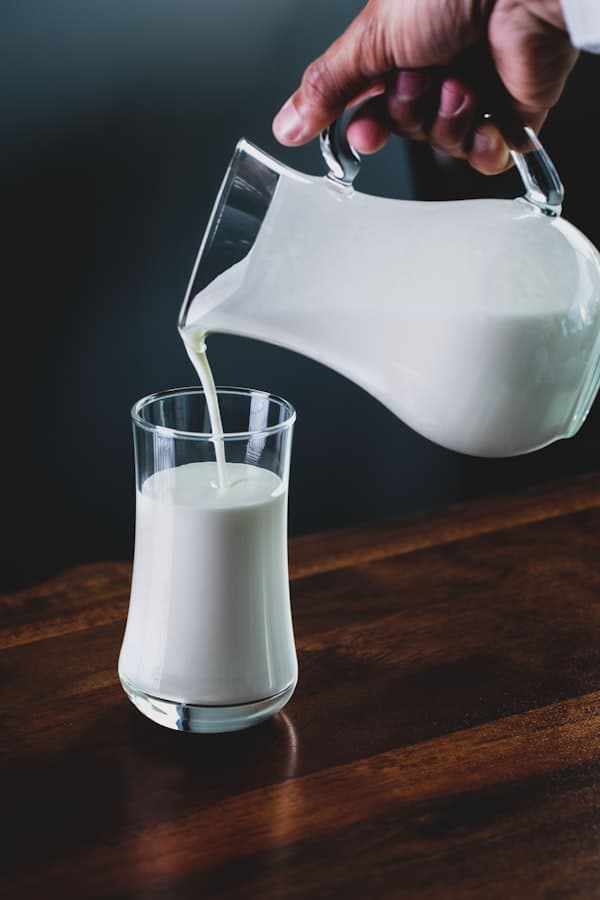 Fresh cow milk in a glass bottle sourced from local farms